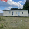 Działka budowlana 1200 m² z domkiem mobilnym.