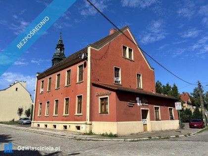 Działka zabudowana budynkiem magazynowo administracyjnym