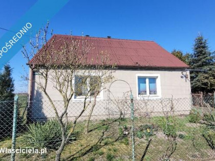 Działka zabudowana domem i budynkiem gospodarczym