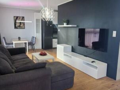 Słoneczny apartament Gdańsk wyposażenie klima deski dębowe