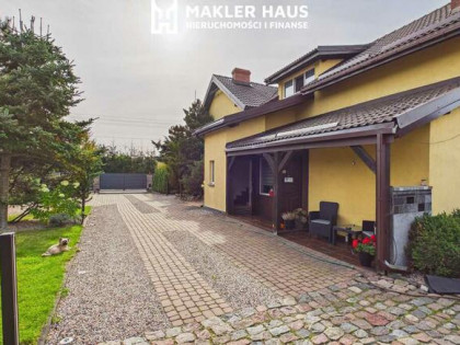 Dom z potencjałem inwestycyjnym – 194 m², pokoje na wynajem, 2 garaże